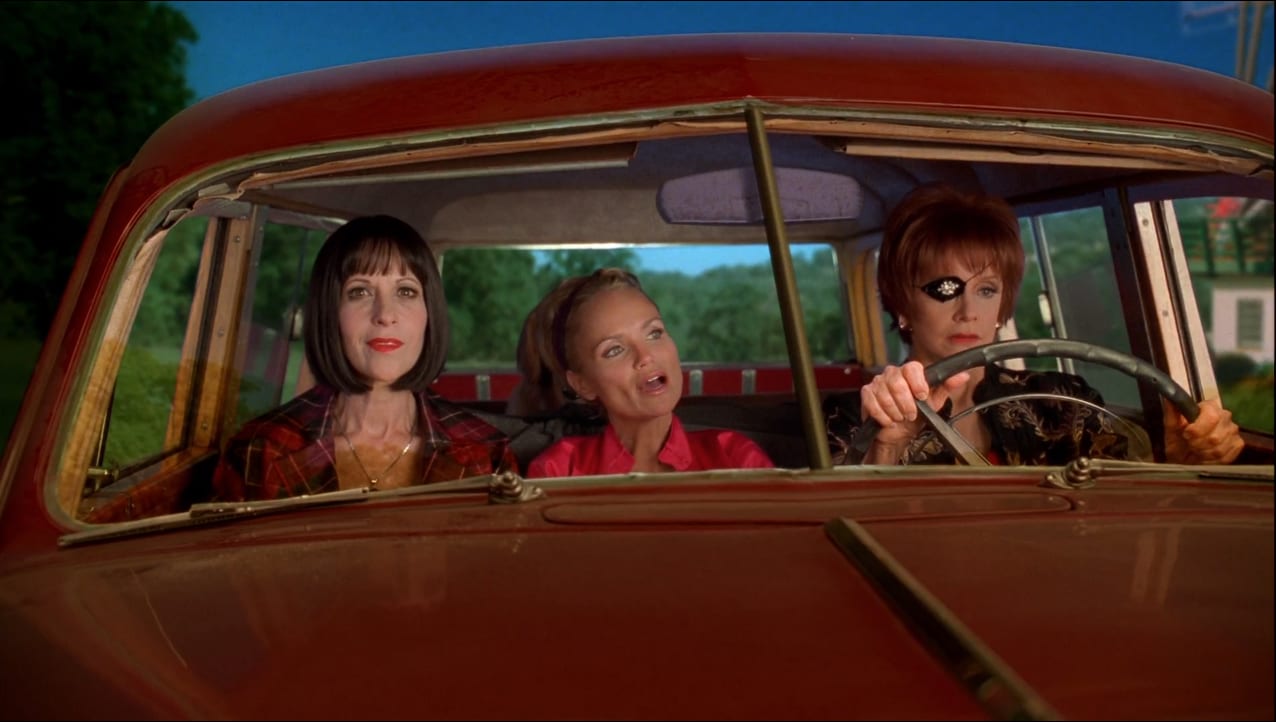 Olive (Kristen Chenoweth) sings in a car with Vivian (Ellen Greene) and Lily (Swoosie Kurtz).