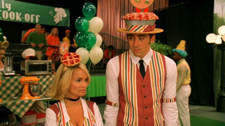 Olive (Kristen Chenoweth) talks with Ned (Lee Pace) while in pie uniforms.