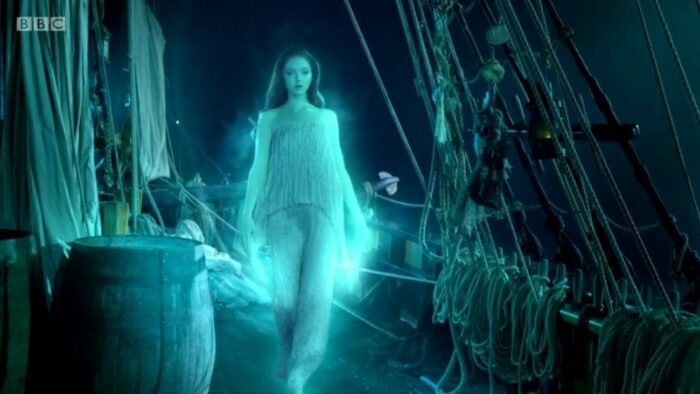 The Siren enters the ship, glowing blue