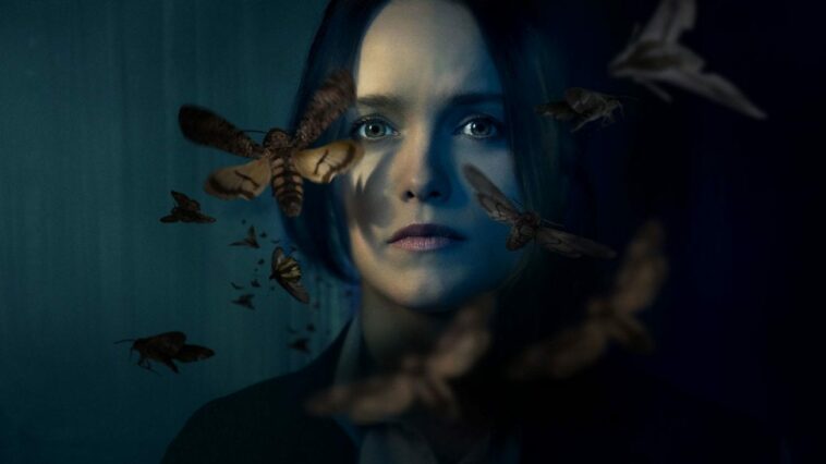 Face shot of Clarice Starling, surrounded by swirling moths