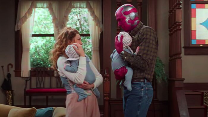 Wanda and Vision hold their twin babies in their '80s style house