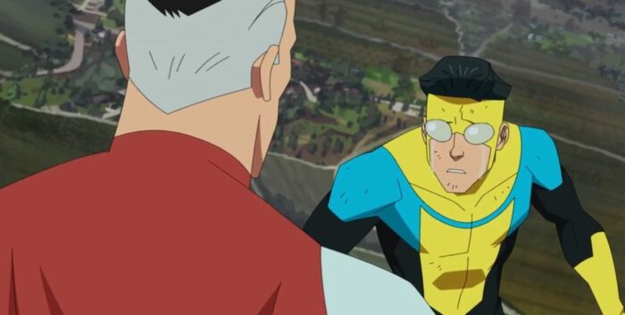 Invincible listens to Omni-man while they fly in the sky. He is in tears.