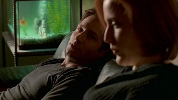 Mulder talks with Scully...