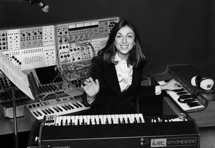 Suzanne Ciani sits at a synthesizer.