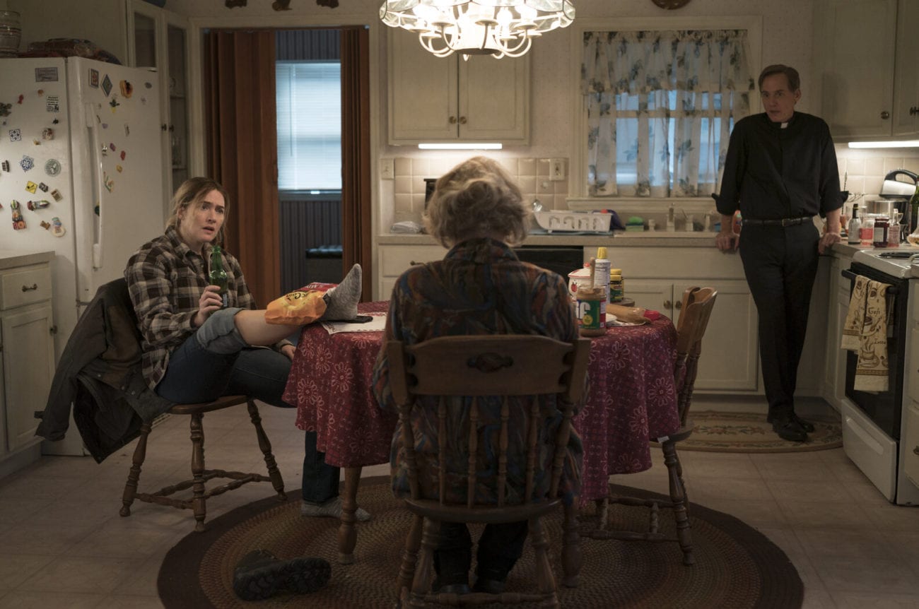 Mare (Kate Winslet) has a conversation with her mother Helen (Jean Smart) and cousin, Father Dean Hastings (Neal Huff)