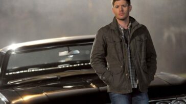 Dean leaning on Baby, with fog in the background in Supernatural