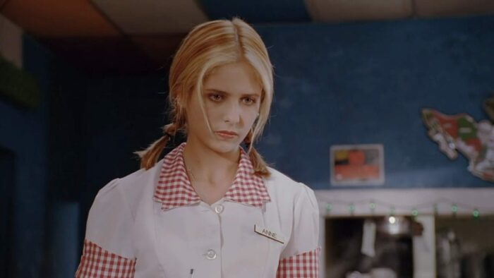 Buffy in a waitress' uniform, with the name badge 'Anne' in S3E1