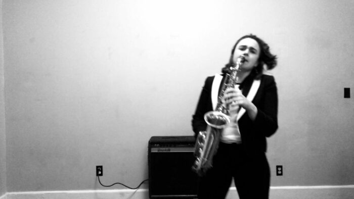 Anna Meadors of Joy on Fire playing saxophone.