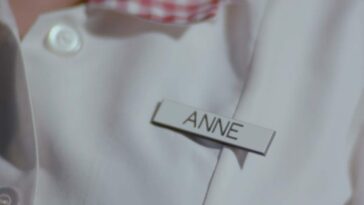 A close-up on Buffy's name badge in the Season 3 opener, reading 'Anne'