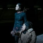 Jenna Coleman walks besides Warwick Davis in Doctor Who Nightmare in Silver