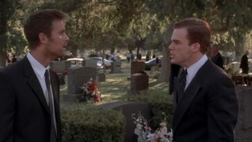 Nate and David face off standing in a cemetery