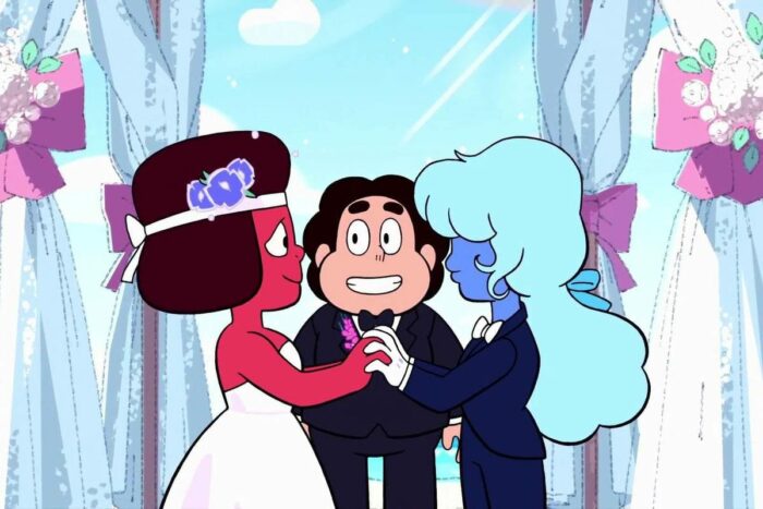 Ruby, in a wedding dress and Sapphire, in a suit, are reading their wedding vows as Steven stands behind them