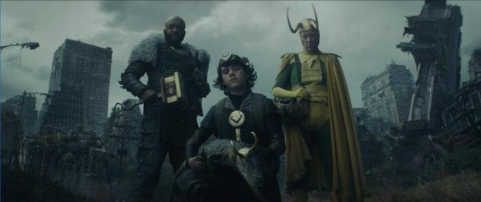 Boastful Loki, Crocodile Loki, Kid Loki, and Classic Loki (left to right) stand awaiting Tom Hiddleston's Loki.