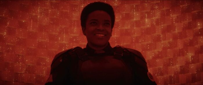 Hunter B-15 sits in a red cell and laughs at Ravonna's arrogance.