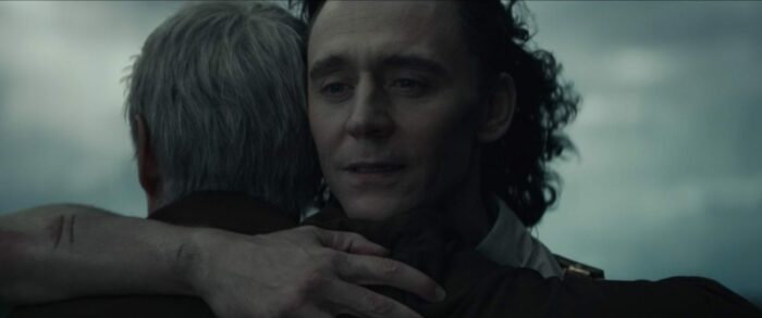A tearful Loki (right) embraces Mobius (left) for the first time.