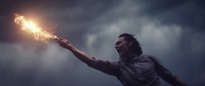 Loki distracts Alioth with a flaming dagger.