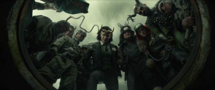 President Loki (center) leers down at Loki, surrounded by other Loki variants.
