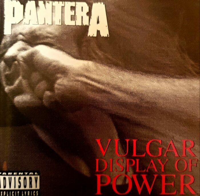 Man getting punched in the face for Pantera's Vulgar Display of Power album cover