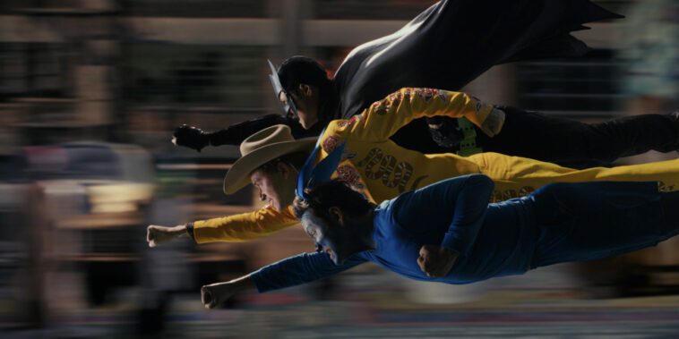 Josh, Dax and Victor fly through the air, punching, in a cartoonish style in Mr. Corman Action Adventure
