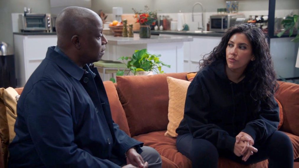 Holt and Rose sit together on a couch