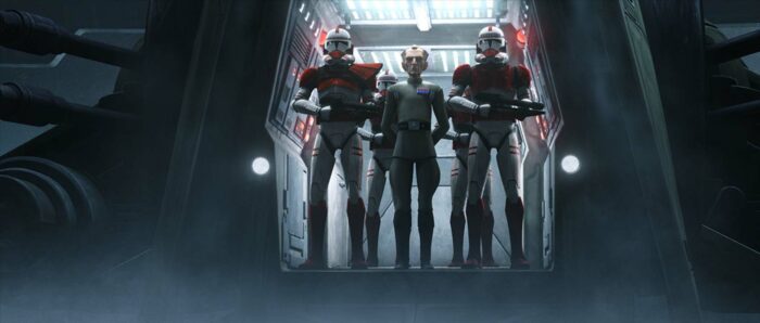 Grand Moff Tarking standing aboard a starship with two clone troopers beside him.