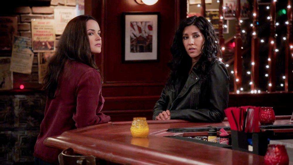 Amy and Rosa sit at the bar