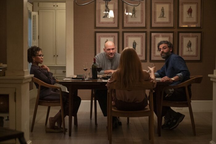 In this image from Scenes from a marriage, the characters Mira and Jonathan are seated at a dinner table with Kate (Nicole Beharie) and Peter (Corey Stoll). 