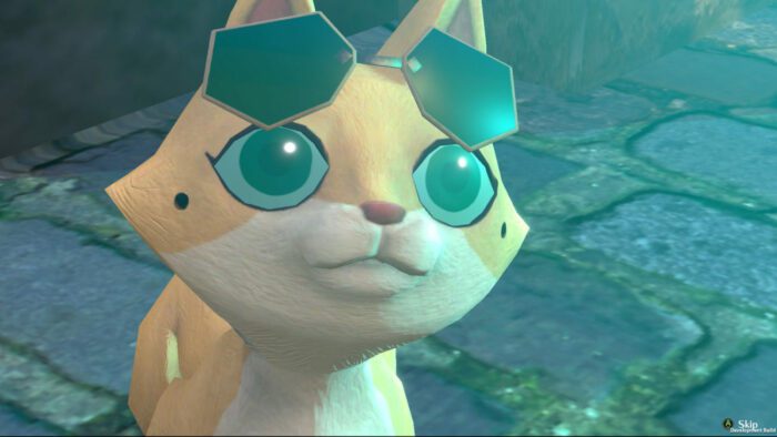 A yellow cat with sunglasses looks at a bright light