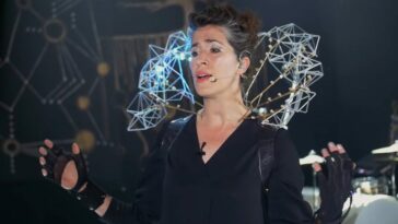 Imogen Heap sings and performs with her Mi.Mu gloves.