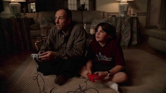 Tony Soprano (James Gandolfini) and A.J. Soprano (Robert Iler) playing video games together