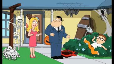 American dad, wife and son in the yard on Halloween, with a skeleton decoration