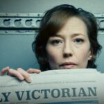 Nora holds up a newspaper with the day's date, October 15, 2018, written on it in The Leftovers finale