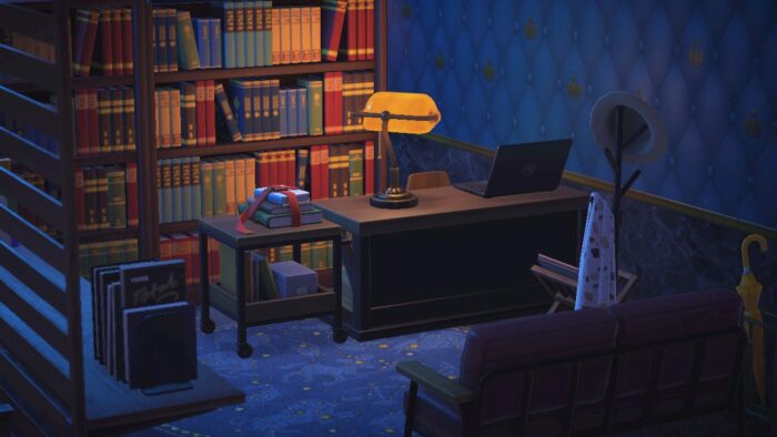 A desklamp sits on a desk with bookshelves in the background in Animal Crossing: New Horizons