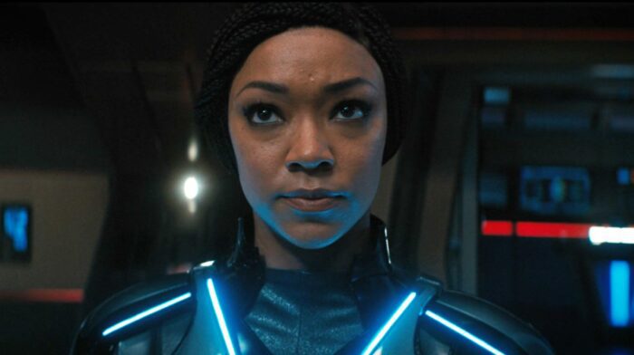 Close up of Captain Burnham (Sonequa Martin-Green) in her safety suit, looking determined