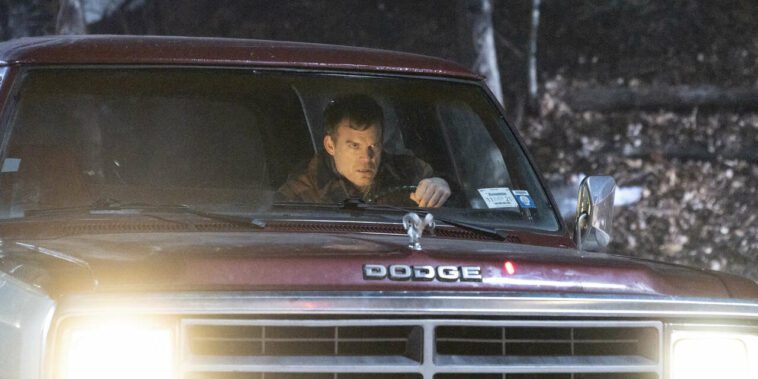 Dexter in a truck, ready to save his son