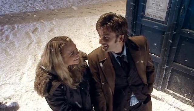 Rose and the Doctor smiling at each other amongst the snow in 'The Christmas Invasion'
