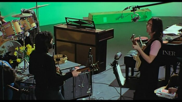 Image from The Beatles: Get Back: Paul McCartney and John Lennon during the Get Back sessions.