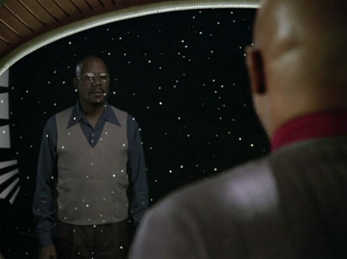 Sisko looks at his reflection in his window, and sees Ben Russell looking back at him.