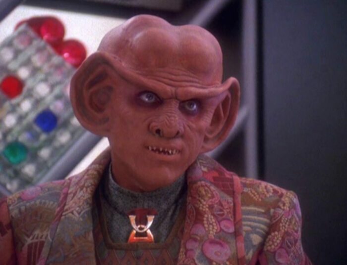 Quark, in his bar, with an "oh REALLY?" look on his face/