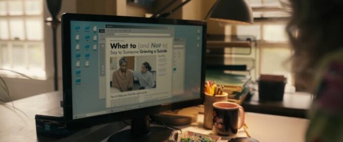 A computer screen on Misty's desk is on a website that reads "What to (and not to) say to someone grieving a suicide