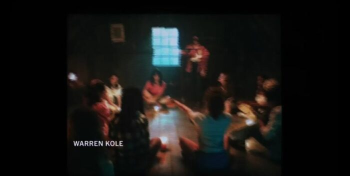 The girls sit in a circle on the floor