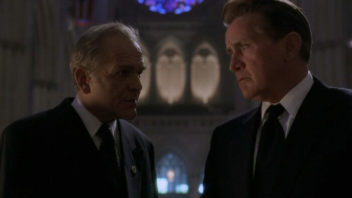 Bartlet and Leo (John Spencer) stand in the Cathedral