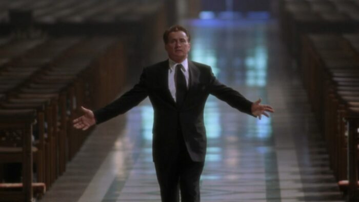 President Bartlet walks with his arms spread wide