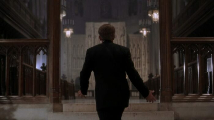 Bartlet with his back to the camera walking up the stairs to the inner sacntum
