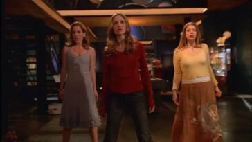 Buffy stands in the center with Anya and Tara behind her singing backup