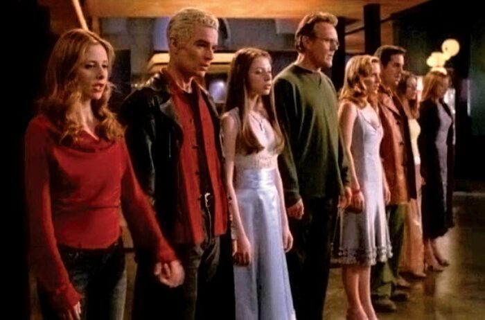 The Scoobies all stand hand in hand singing at the end of "Once More, With Feeling"