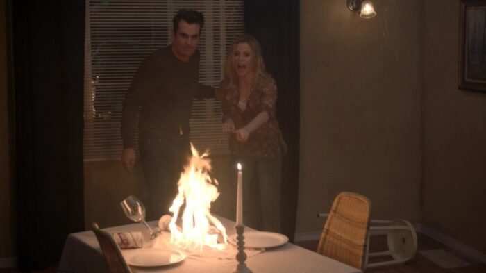 Phil and Claire are alarmed to discover their tablecloth is on fire