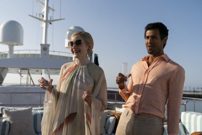Anna and her boyfriend toast with champagne on a yacht. 