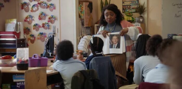 A teacher shows a picture of George W. Bush in Abbott Elementary