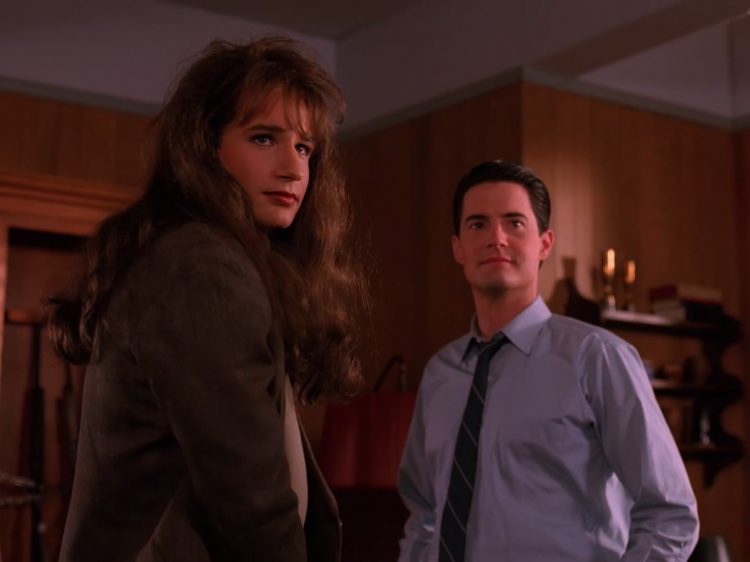Denise Bryson stands beside Agent Cooper in the Sheriff's office